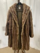 A TWO COLOUR FUR COAT.