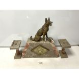 A FRENCH ART DECO SPELTER DOG MOUNTED TWO COLOUR MARBLE THREE PIECE CLOCK GARNITURE.