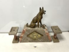 A FRENCH ART DECO SPELTER DOG MOUNTED TWO COLOUR MARBLE THREE PIECE CLOCK GARNITURE.