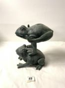 A RESIN FIGURE OF FROGS.