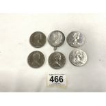 FIVE ISLE MAN ELIZABETH 1979 ONE CROWN COINS, AND A 1878 SILVER ONE DOLLAR COIN IN MOUNT.