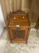 A LATE VICTORIAN CARVED MAHOGANY COAL PURDONIUM WITH BRASS HANDLES, 36 X 66 CM.