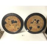 A PAIR OF BRETBY POTTERY ORIENTAL DESIGN WALL PLATES. 34 CMS DIAMETER.