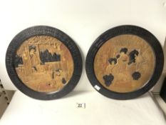 A PAIR OF BRETBY POTTERY ORIENTAL DESIGN WALL PLATES. 34 CMS DIAMETER.