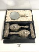 A HALLMARKED SILVER EMBOSSED FIVE PIECE DRESSING TABLE SET IN FITTED CASE. BIRMINGHAM 1942, MAKER