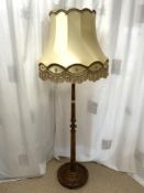 A 1940s TURNED COLUMN LAMP STAND WITH SILK SHADE.