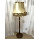 A 1940s TURNED COLUMN LAMP STAND WITH SILK SHADE.