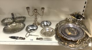 TWO SILVER-PLATED SALVERS, PLATED CONDIMENTS, CANDELABRA, AND OTHER PLATED WARES.