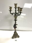 A PAINTED METAL FIGURAL FOUR BRANCH CANDELABRUM, 56 CMS.