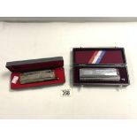 A HOHNER CHROMATIC HARMONICA IN CASE, AND A HUANG PROFESSIONAL 1248 HARMONICA.
