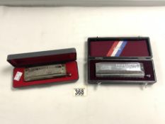 A HOHNER CHROMATIC HARMONICA IN CASE, AND A HUANG PROFESSIONAL 1248 HARMONICA.