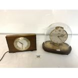 A KUNDO ELECTRONIC CLOCK UNDER GLASS DOME, AND A 1960s METAMEC ELECTRIC MANTEL CLOCK.