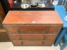 A MOROCCAN STUDDED LEATHER THREE DRAWER CHEST OF DRAWERS, WITH IRON RING HANDLES, 101X40X87 CMS.