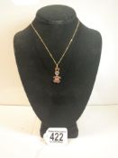 750 GOLD NECKLACE WITH A 375 PENDANT WITH STONES ( RABBIT )