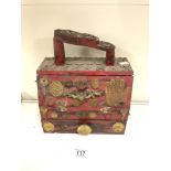 A RED PAINTED WOODEN SHOE SHINE BOX, WITH MOUNTED COINS, KEYS AND A MEXICAN FOLK ART PLAQUE