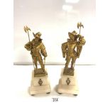 A PAIR OF GILDED SPELTER FIGURES OF CAVALIERS ON ALABASTER STANDS, 36 CMS.