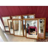A SET OF EIGHT FRAMED CHERRY WOOD MIRRORS, 37X63.