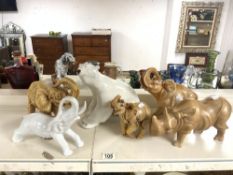 THREE RESIN & ONE CERAMIC ELEPHANTS WITH A WOODEN RHINO AND CERAMIC POLAR BEAR LARGEST 26CM