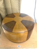 A MID-CENTURY TWO-COLOUR SHERBOURNE LEATHERETTE POUFFE.