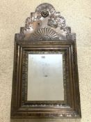 A MEXICAN COPPER WALL MIRROR WITH BEATEN DECORATION AND APPLIED BIRD MOTIF, A/F, 50 X 96 CM.