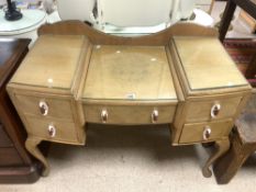 A 1930s BLEACHED WALNUT SUNK CENTRE DRESSING TABLE WITH BAKELITE HANDLES, 110 X 50 X 80 CM.