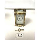 A FRENCH BRASS CARRIAGE TIMEPIECE - WITH KEY, MAKER R & CO PARIS.