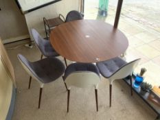 A MID-CENTURY DESIGN ITALIAN CIRCULAR ROSEWOOD TOP AND METAL BASE DINING TABLE, AND FIVE MATCHING