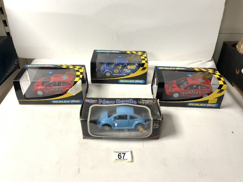 THREE BOXED SCALEXTRIC CARS, AND A DIE-CAST PLASTIC NEW BEETLE.