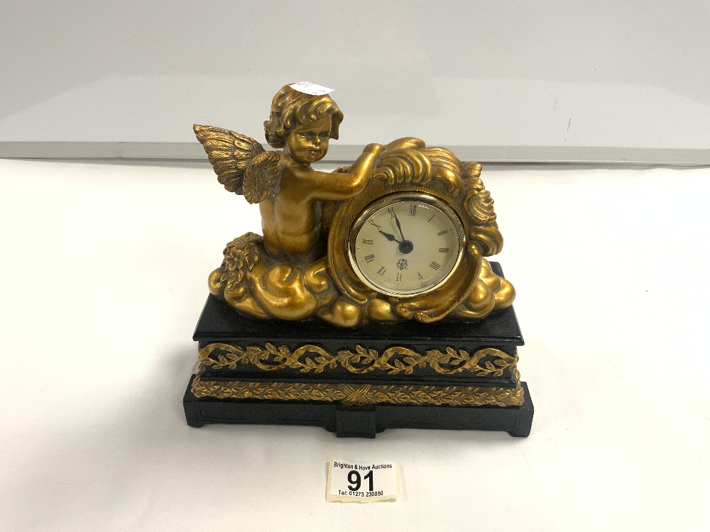 SMALL RESIN MANTLE CLOCK WITH GILDED CHERUB 22CM