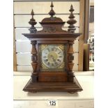 A GERMAN MAHOGANY AND WALNUT ARCHITECTURAL DESIGN MANTEL CLOCK, WITH SILVERED CHAPTERED DIAL,