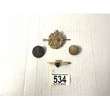 A ROYAL FLYING CORPS HAT BADGE, TWO BUTTONS AND AN ENAMEL BOAC BADGE.