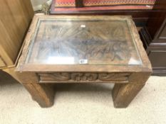 AN ANTIQUE MEXICAN RUSTIC CARVED PINE GLASS TOP COFFEE TABLE, 64 X 45 X 48 CM.