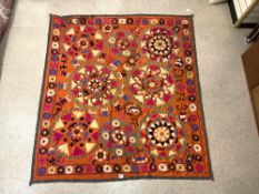 SUZANI FLORAL EMBROIDERED MULTICOLOURED WALL HANGING ON ORANGE BACKGROUND FROM UZBEKISTAN, `170 X