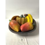 A WOODEN BOWL OF PAINTED FAUX FRUIT AND VEG.