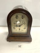 A MAHOGANY DOME TOP CHIMING MANTEL CLOCK, WITH SILVERED DIAL. MOVEMENT MARKED D.R,P. 357338. 35X22