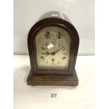 A MAHOGANY DOME TOP CHIMING MANTEL CLOCK, WITH SILVERED DIAL. MOVEMENT MARKED D.R,P. 357338. 35X22