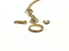 A YELLOW METAL WATCH CHAIN, 14GMS, 9CT HALLMARKED OCTAGONAL WEDDING RING 2.4 GMS, AND TWO CHARMS.