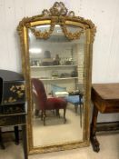 ORNATE GILTWOOD BEVELLED WALL MIRROR WITH FLORAL SWAG APPLIED DECORATION, 80X172 CMS.