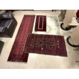 THREE RED GROUND TURKISH RUGS, INCLUDES A RUNNER, 284X80 AND CHINESE RUG, 242X154.
