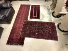 THREE RED GROUND TURKISH RUGS, INCLUDES A RUNNER, 284X80 AND CHINESE RUG, 242X154.