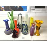 TEN COLOURED ART GLASS VASES OF VARIOUS DESIGNS, 38 CMS TALLEST.