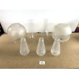 TWO ETCHED GLASS OIL LAMP GLOBE SHADES AND CHIMNEYS, AND 3 SMALL GLASS PINEAPPLE SHADES.