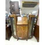 A 1930s BOW FRONTED WALNUT GLAZED BUREAU/CABINET ON BALL AND CLAW FEET.120X30X124 CMS.