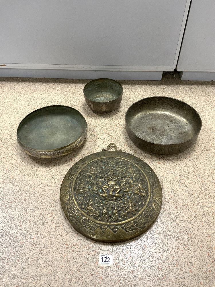 INDIAN EMBOSSED BRASS PLAQUE 35 CM, AND FOUR EASTERN EMBOSSED DECORATED METAL BOWLS.