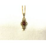 9 CARAT GOLD NECKLACE WITH A 9 CARAT GOLD PENDANT WITH DIAMONDS AND GARNET