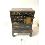 LATE 19TH-CENTURY JAPANESE BLACK AND GOLD LACQUERED TABLE CABINET ON STAND DECORATED WITH BIRDS