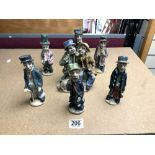 SEVEN GLAZED POTTERY FIGURES, BY NORMAN UNDERHILL, 17 CMS.