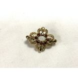 375 GOLD WITH GARNETS AND CENTRAL OPAL BROOCH