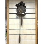 BLACK FOREST CUCKOO CLOCK WITH WEIGHTS.