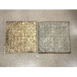 TWO DECORATVE EMBOSSED METAL WALL TILES, 60X59 CMS.